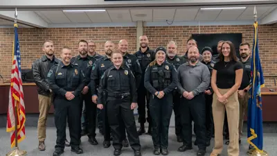 Group photo of Meridian Township police officers after a swearing in ceremony